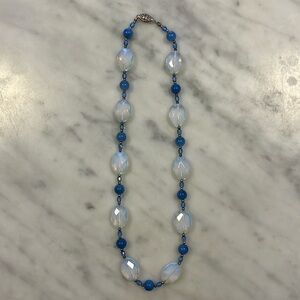 Pretty blue and white beaded necklace.  Very good used condition.  About 18”